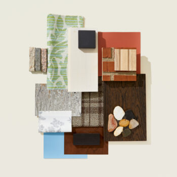 A flat lay inspired by American Colonial design featuring, wood, brick, stone, and pops of color in green and blue in a variety of materials.