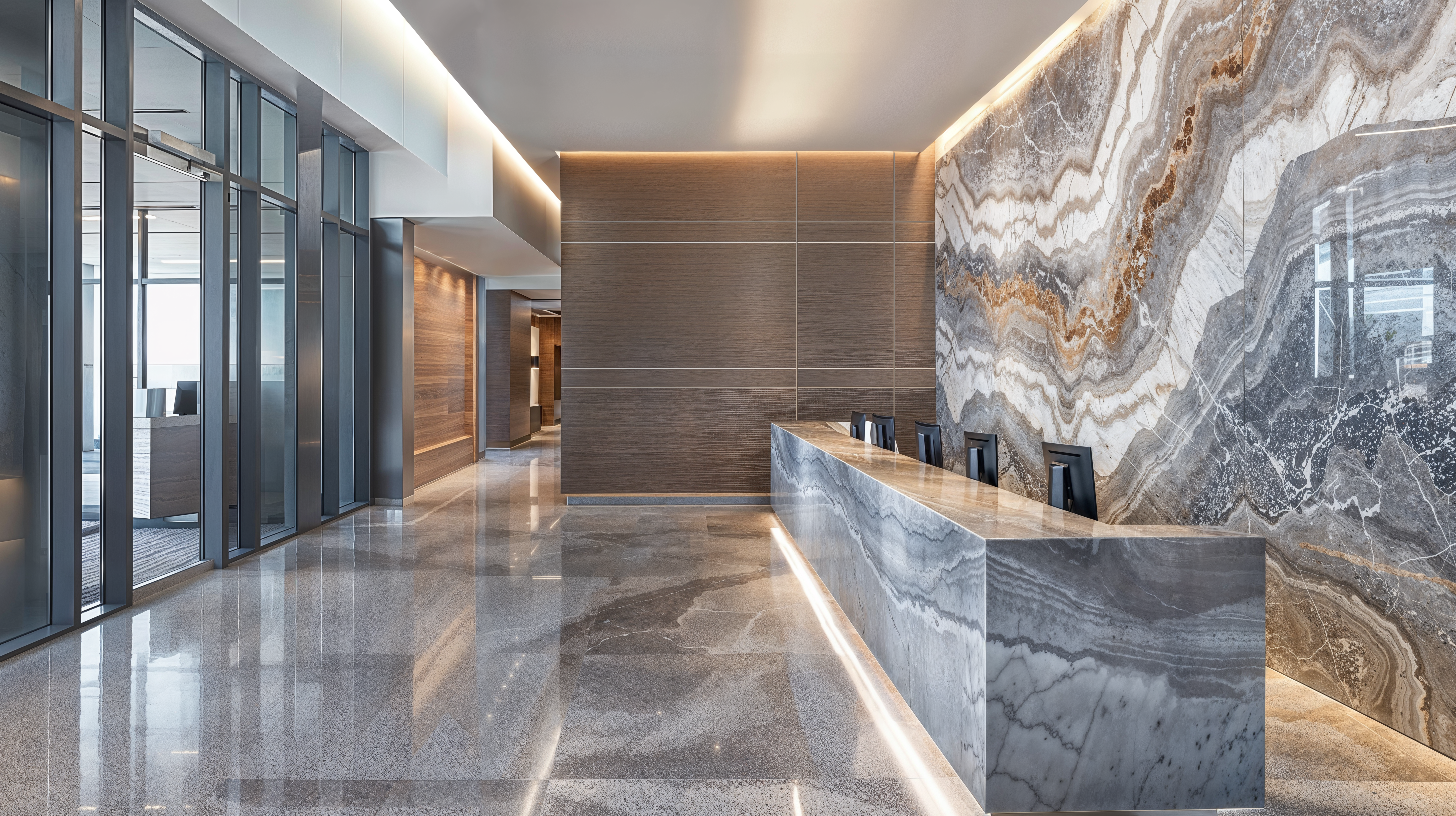 A commercial space lobby with quartz walls and desk in a sleek modern design.