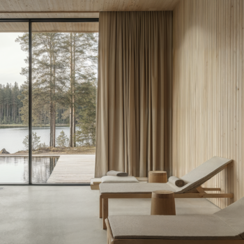 A Finnish sauna with wooden wall paneling, concrete floors, and beige textiles.
