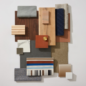 The NeoCon 2025 flatlay with warm woods, lush textiles, and trendy wallcoverings.