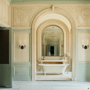 A neo-baroque spa suite with marble floors, ornate walls, and large mirrors.