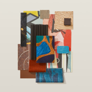 A flatlay photograph with red textiles, blue tiles, and colorful wallcoverings.