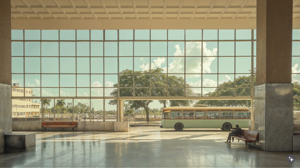 Cuban Design bus station with stone flooring, decorative ceiling details, and large gridded windows letting in lot of natural light. 