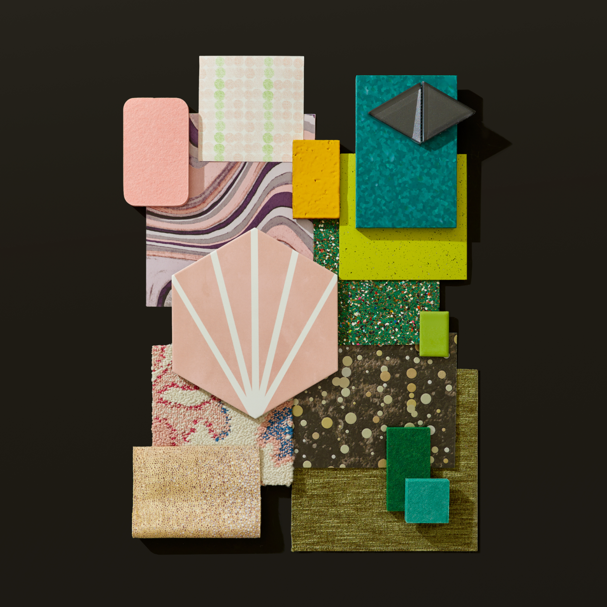 Emerald Enchantment collection inspired by Broadway's musical Wicked contains a variety of materials in pinks, greens and gold in a variety of shapes, textures and materials.