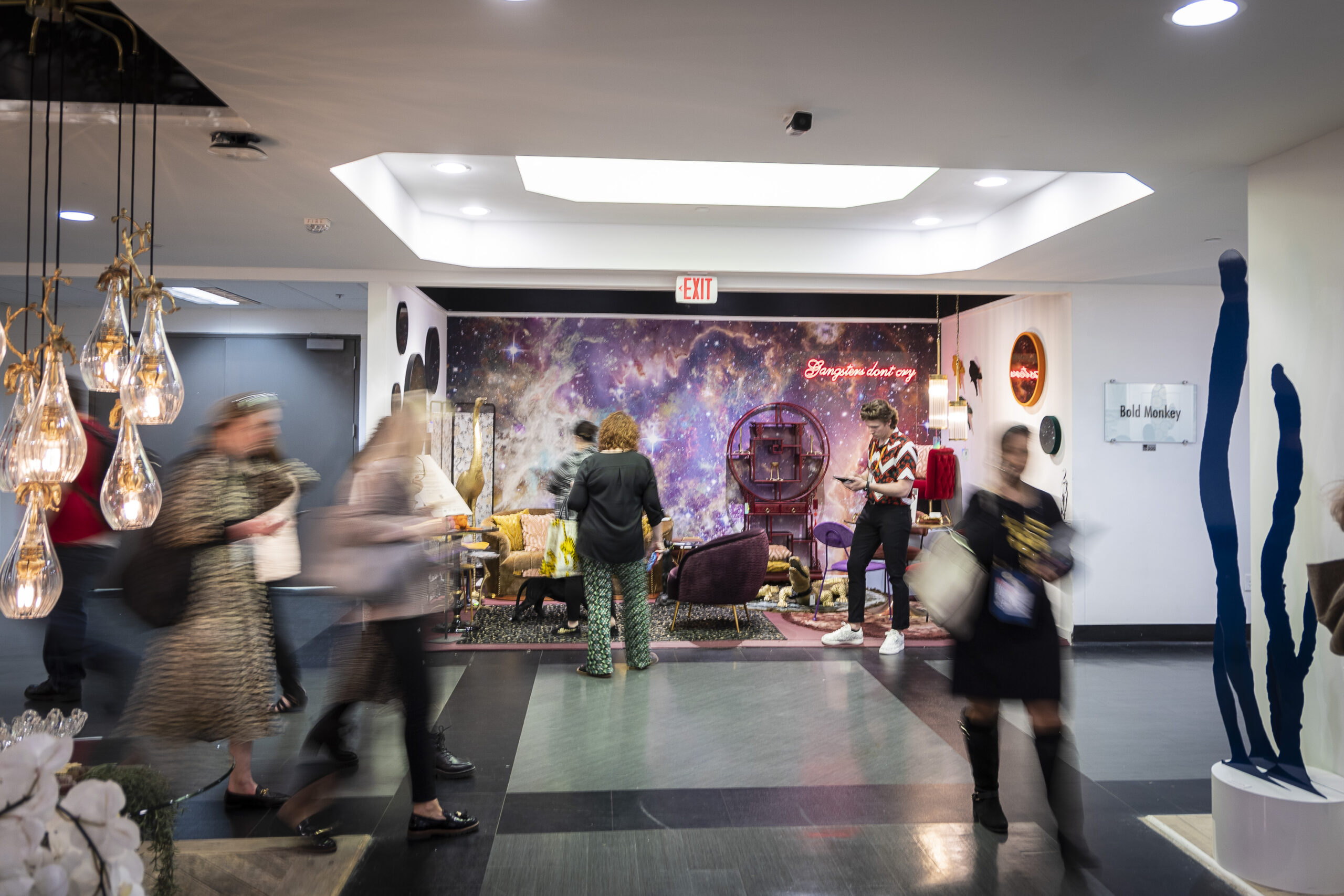 People walking through a hallway at High Point Market, the largest furniture and decorative accessories trade show in the world.