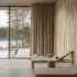 A Finnish sauna with wooden wall paneling, concrete floors, and beige textiles.