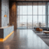 An Icelandic minimalist designed healthcare space with concrete walls, modular furniture, and floor to ceiling windows.