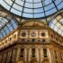 Photograph of Galleria Vittorio Emanuele II, Milan, Metropolitan City of Milan, Italy. Looking up at the building and the glass ceilings.